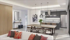 Cuisine ouverte et salle à manger dans un appartement Mont Choisy La Réserve