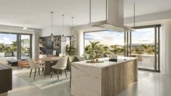 Cuisine et salle à manger contemporaines dans un penthouse La Réserve au coucher du soleil